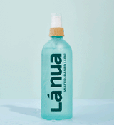 Animated GIF of a 200ml bottle of La Nua unflavored water-based lubricant with water splashing around it.