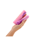 A hand holding a purple vibrator with a color gradient from dark to light purple, shown against a white background.