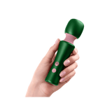 A hand holding the dark green FemmeFunn Bougie Wand, showing its ergonomic shape and button placement.
