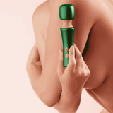 A person holding the dark green FemmeFunn Bougie Wand against their bare shoulder to show its scale. 