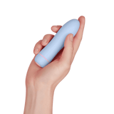 A hand holding the light blue and pink ffix Bullet to show its compact size.
#color_lightblue
