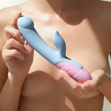 Lifestyle image of a person holding the light blue and pink FemmeFunn ffix Rabbit against their bare chest.