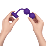 Hands holding the FemmeFunn Momenta in purple.