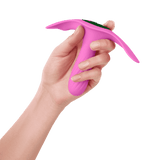 A hand holding the FemmeFunn Ossia wearable bullet vibrator in pink.