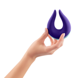 A hand holding the FemmeFunn Volea in dark purple.
